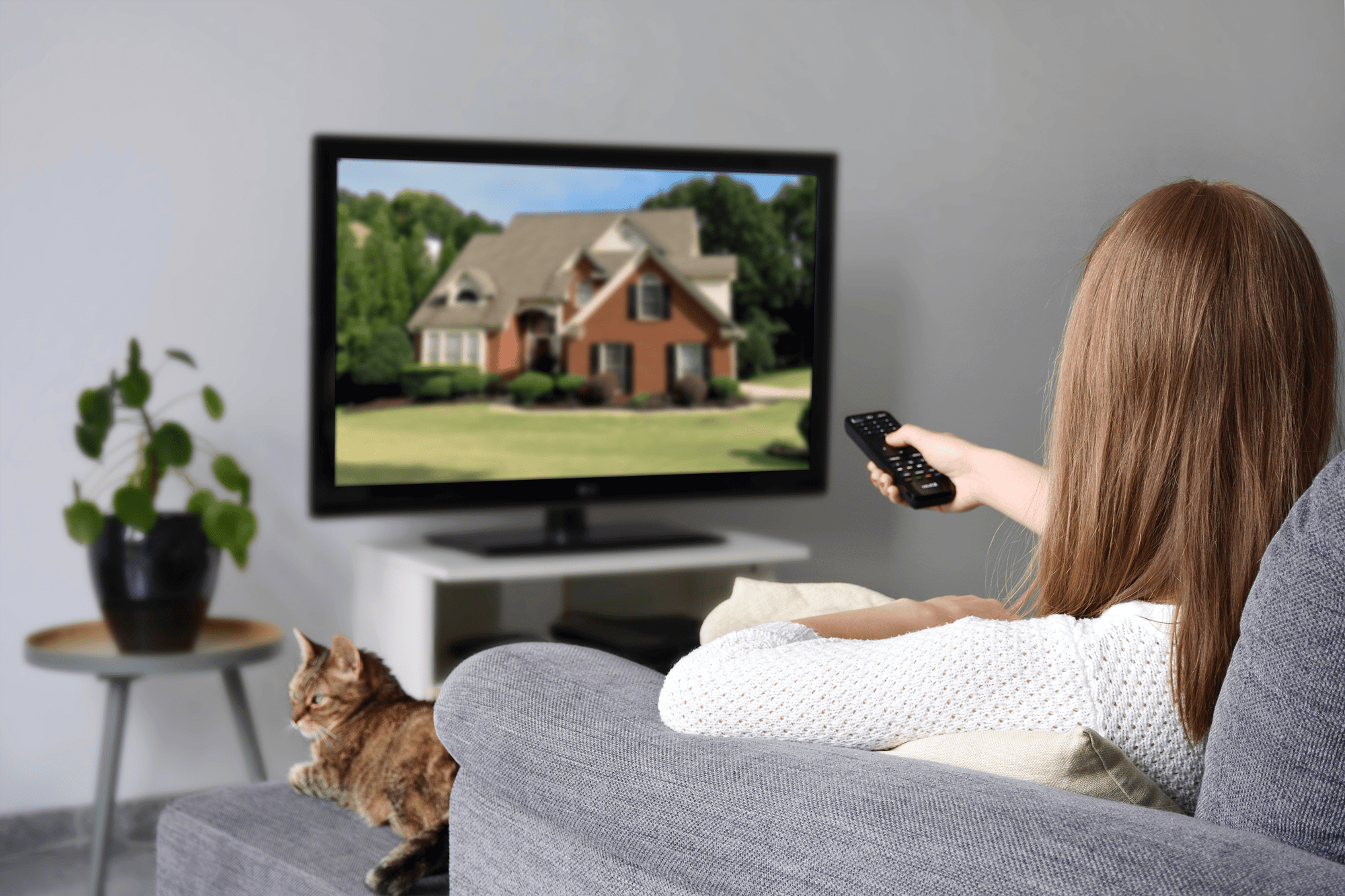 girl watching house commercial on tv-min