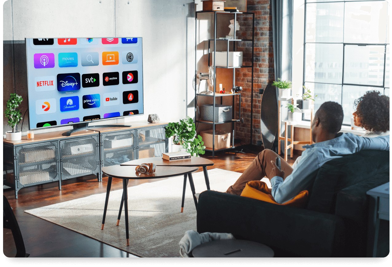 couple watching connected tv in living room