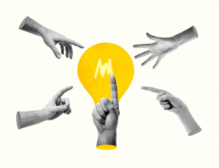 several hands point to a yellow lightbulb against a white background