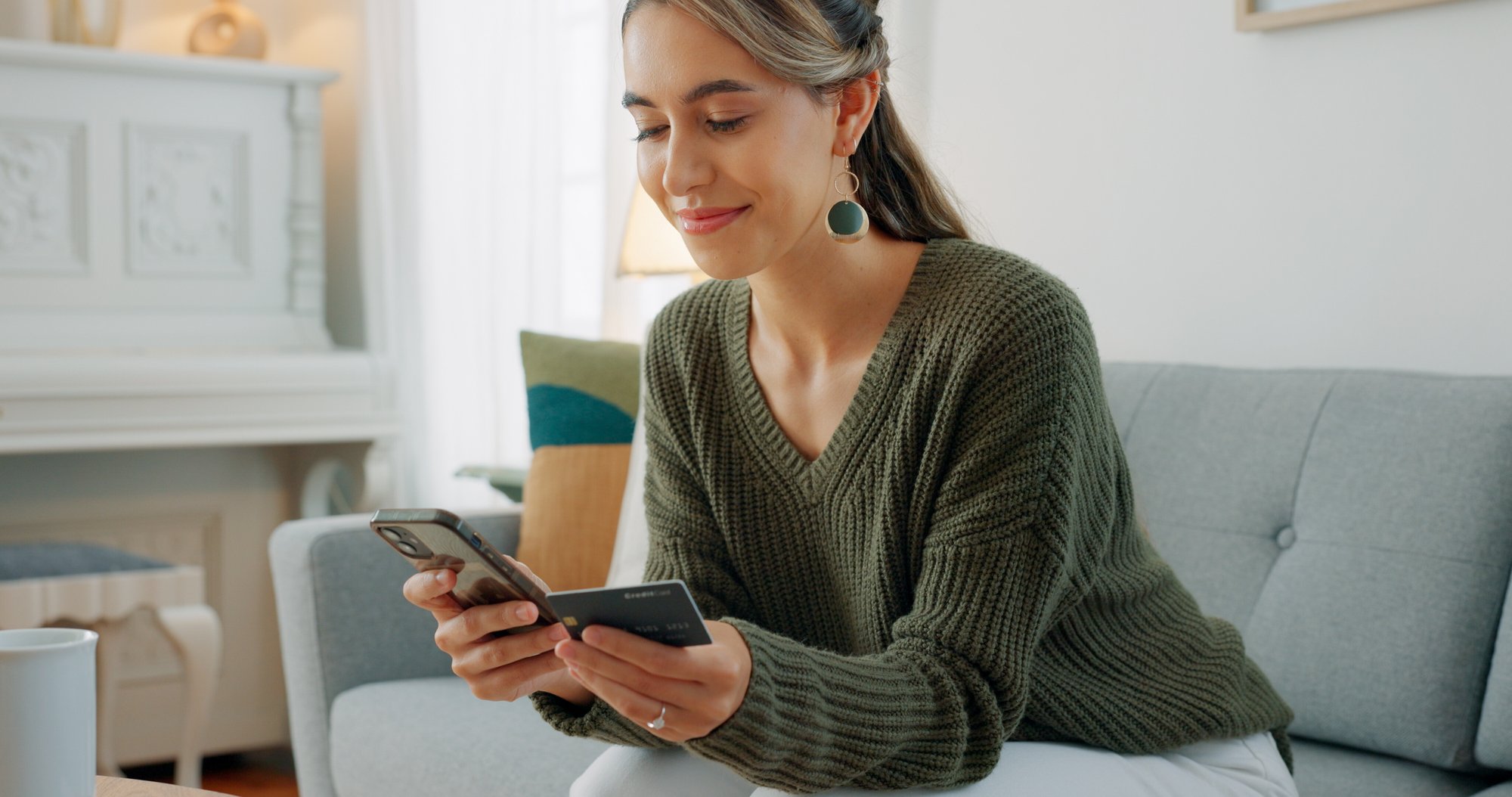 woman holding credit card