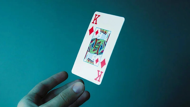 King of diamonds card against a blue background
