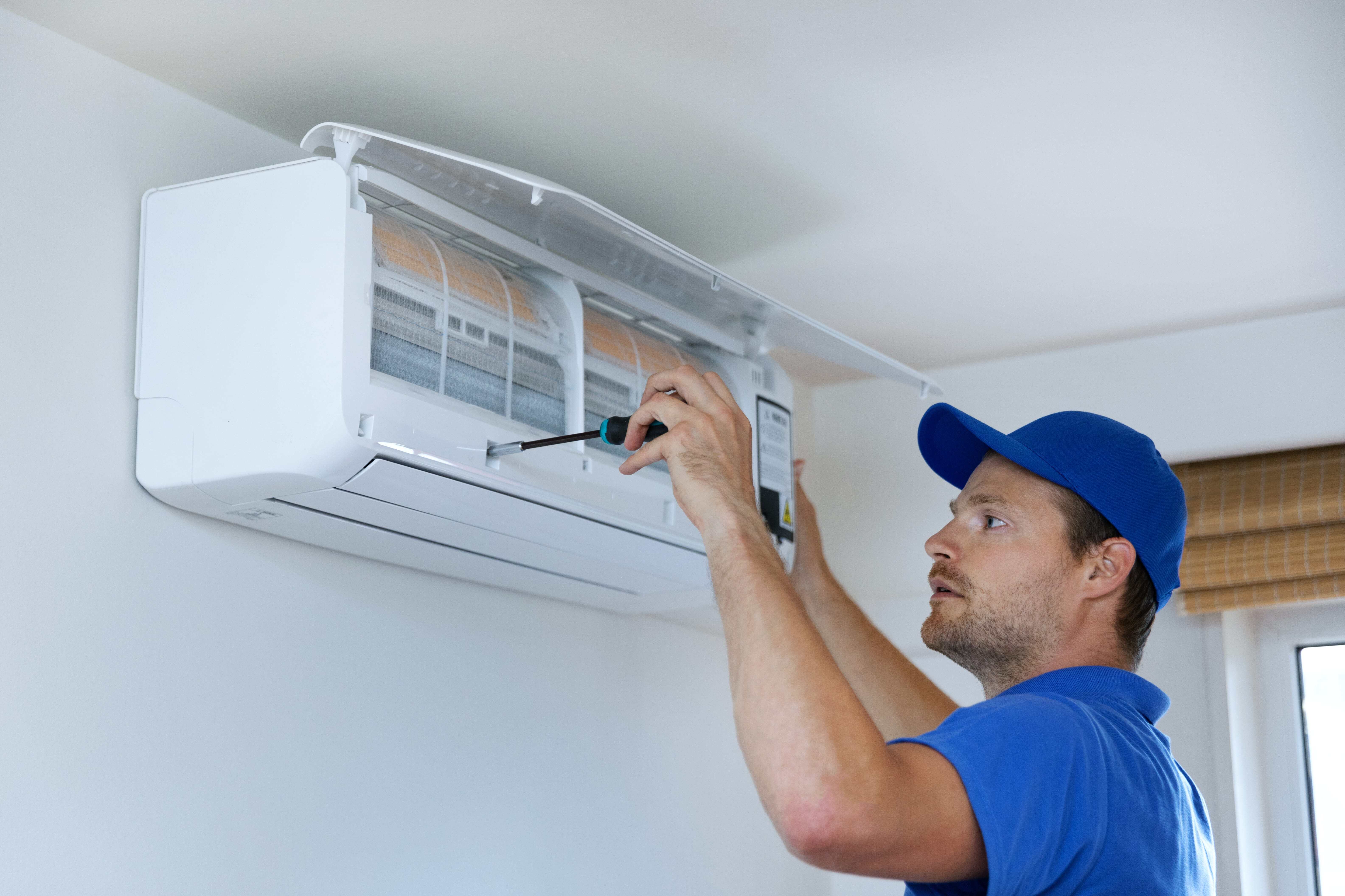 hvac technician installing mini split
