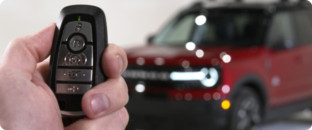 holding car key