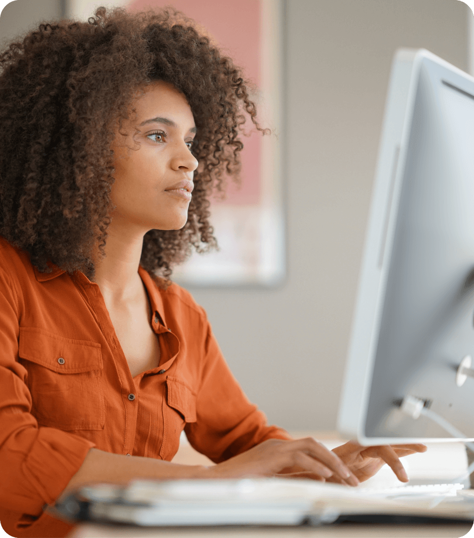 woman editing ctv creative on desktop computer